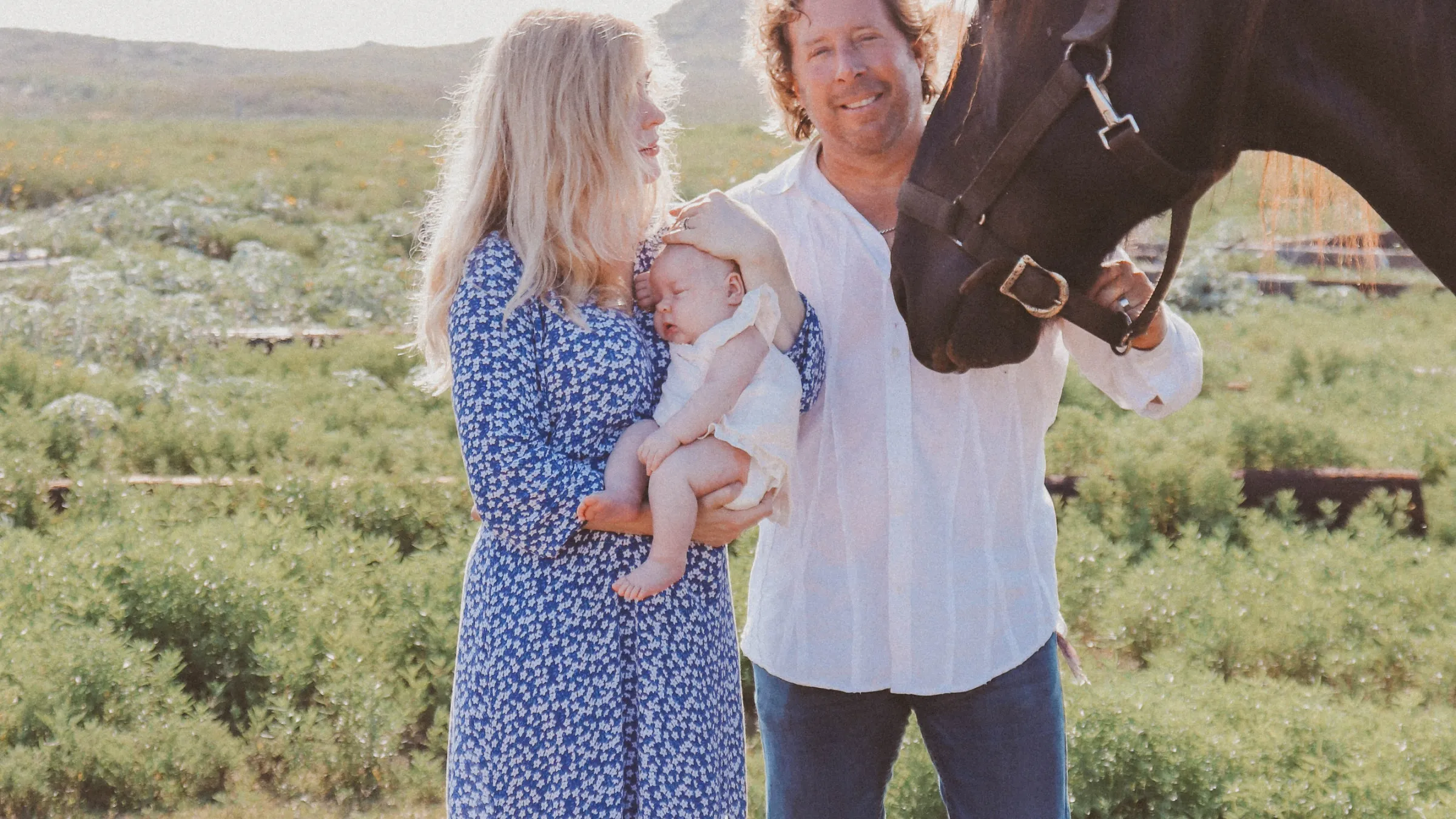 a person standing next to a horse